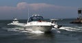 Motor boats entering and leaving the shinnecock canal at Peconic Bay Royalty Free Stock Photo