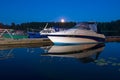 Motor boats rest at night