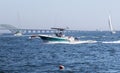 Motor boats and sailboats and waverunner moving in the great south bay