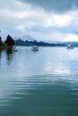 Motor boats and a sailing yacht anchored in Whangaroa Harbour, F