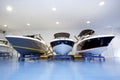 Motor boats in showroom or garage