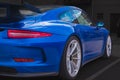 Porsche Turbo blue sports car coupe on dark background. Motor car Porsche in the street. Luxury blue Porsche on a street Royalty Free Stock Photo