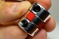 Motor coupling to reduce vibration and smooth start and running of mechanism is in the hand of a child.
