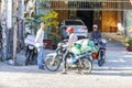 Motor cyclist meet on a street in Nam Tien, Vietnam