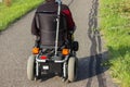 motor-driven wheel chair on a street in september fall Royalty Free Stock Photo