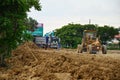 Motor grade Machine and people working at construction site