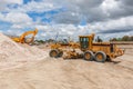 Motor Grader and Hydraulic Excavator on Construction site