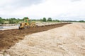 The Motor grader working