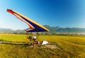 Motor hang glider close up, on the ground and man. Royalty Free Stock Photo