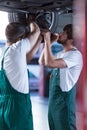 Motor mechanics working in garage