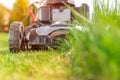 Motor mower to mow the lawn next to the family house Royalty Free Stock Photo