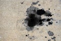 Motor oil stains on concrete pavement/texture background