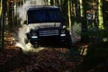 Motor racing in autumn forest. Extreme, competition and four wheel drive vehicle concept Offroad race on fall nature Royalty Free Stock Photo