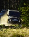 Motor racing in autumn forest. Rallying, competition and four wheel drive concept. Sport utility vehicle or SUV