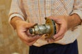 motor rotor is broken,the locksmith holds in his hands the damaged rotor of the circulating water motor