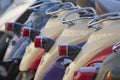 Motor scooters in a city parking lot. Beautiful background of scooter lanterns Royalty Free Stock Photo