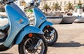 Motor Scooters Mopeds Motorbikes in a Mediterranean Fishing Village Harbor Royalty Free Stock Photo