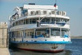 Motor ship. Volgograd. A cruise ship with tourists on the Volga is moored to the pier at the river station, on the central Royalty Free Stock Photo