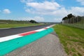 Motor sport circuit asphalt track background curb close up on straight and green field