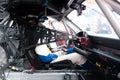 Motor sport Porsche GT driver in touring car cockpit with helmet and racing suit