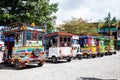 Motor-tricycles decorated as traditional Colombian chivas at the colorful Guatape