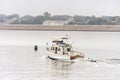 Motor yacht Annabel outbound in New Bedford harbor Royalty Free Stock Photo