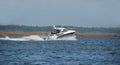Motor yacht sailing on river Royalty Free Stock Photo