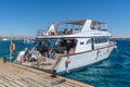 Motor yacht is waiting for scuba divers at a pier in the Makadi Bay, Hurghada, Egypt
