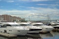 Motor yachts are moored in the Harbor of the yacht club on the Malaya Nevka river. Saint-Petersburg. Against the background of res Royalty Free Stock Photo