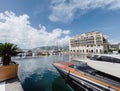 Tivat, Montenegro - 11 august 2023: Motor yachts are moored off the coast overlooking the Regent Hotel. Porto