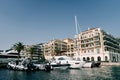 Motor yachts are moored offshore near the Regent Hotel. Porto, Montenegro