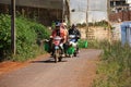 Motorbike carry farmers come home after working day