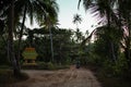 A motorbike drives on a sand road, Ngwesaung, Irrawaddy, Myanmar