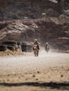 Motorbike driving in dust