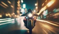 motorbike driving fast in city at night. riding motorcycle front view .ai generated