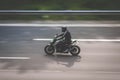 Motorbike driving fast on highway , motion blur