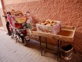 Motorbike loaded with fresh bread in front of local bakery, Marrakech, Morocco.
