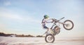 Motorbike, motorcycle athlete and desert drive with mockup cycling in nature for sport adventure. Jump, freedom and Royalty Free Stock Photo