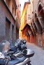 Motorbike parking on Bologna old narrow street Royalty Free Stock Photo