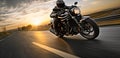 motorbike on the road riding. having fun driving the empty road on a motorcycle tour journey. copyspace for your