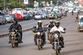 Motorbike taxis on a wide avenue in the capital city, Kampala, Uganda. Royalty Free Stock Photo