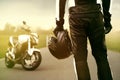 Motorbiker standing in front of his bike Royalty Free Stock Photo