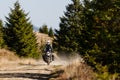 Motorbiker travelling in autumn mountains