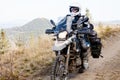 Motorbiker travelling in autumn mountains Royalty Free Stock Photo