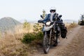 Motorbiker travelling in autumn mountains Royalty Free Stock Photo