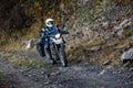 Motorbiker travelling in autumn mountains Royalty Free Stock Photo