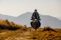 Motorbiker travelling in autumn mountains Royalty Free Stock Photo