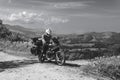 Motorbiker travelling, summer day, motorcycle off road, the driver with adventure, touring motorbike with side bags, extreme
