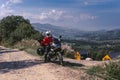 Motorbiker travelling, summer day, motorcycle off road, the driver with adventure, touring motorbike with side bags, extreme