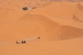 Motorbikers driving off-road in the Erg Chebbi desert near Merzouga Royalty Free Stock Photo